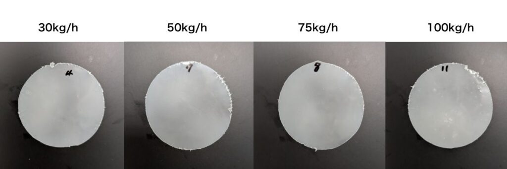 Comparison of press sheet samples processed at different extrusion throughput rates (30kg/h, 50kg/h, 75kg/h, and 100kg/h), showcasing the impact of output volume on dispersion quality and surface smoothness.