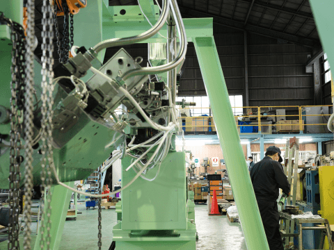 CTE engineers performing maintenance work on the HTM Twin-Screw Extruder in the factory.