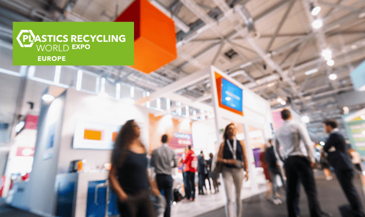 CTE attending the Plastics Recycling World Expo Europe with blurred crowds and booths in the background, showcasing industry networking.